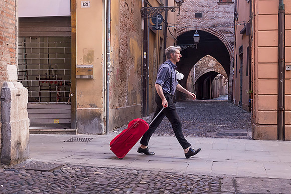 Long Stride and Red Suitcase
