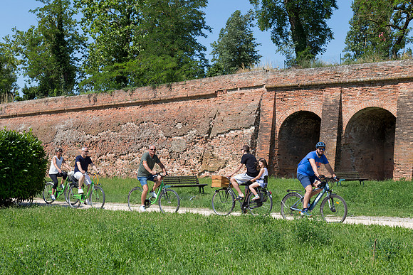 Cycling By City Walls